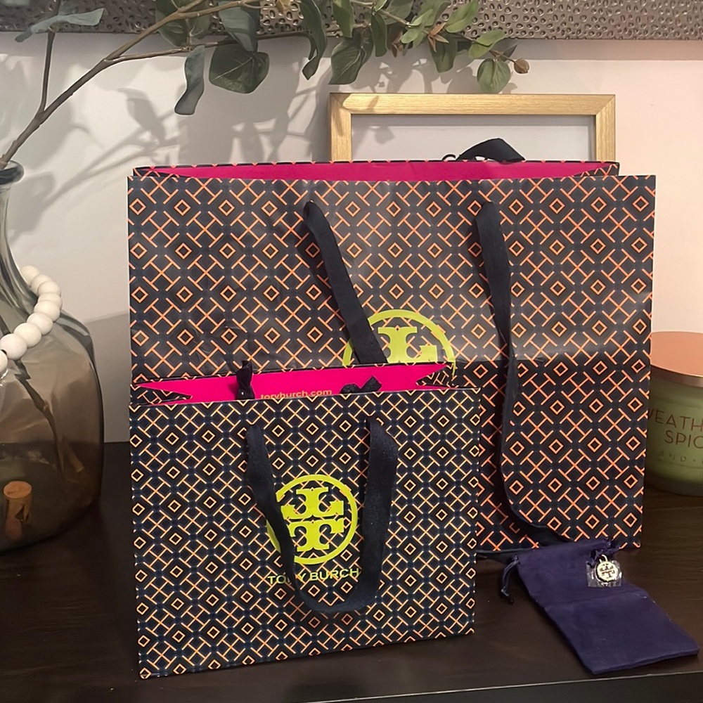 2 Shopping bags and one jewelry bag with charm